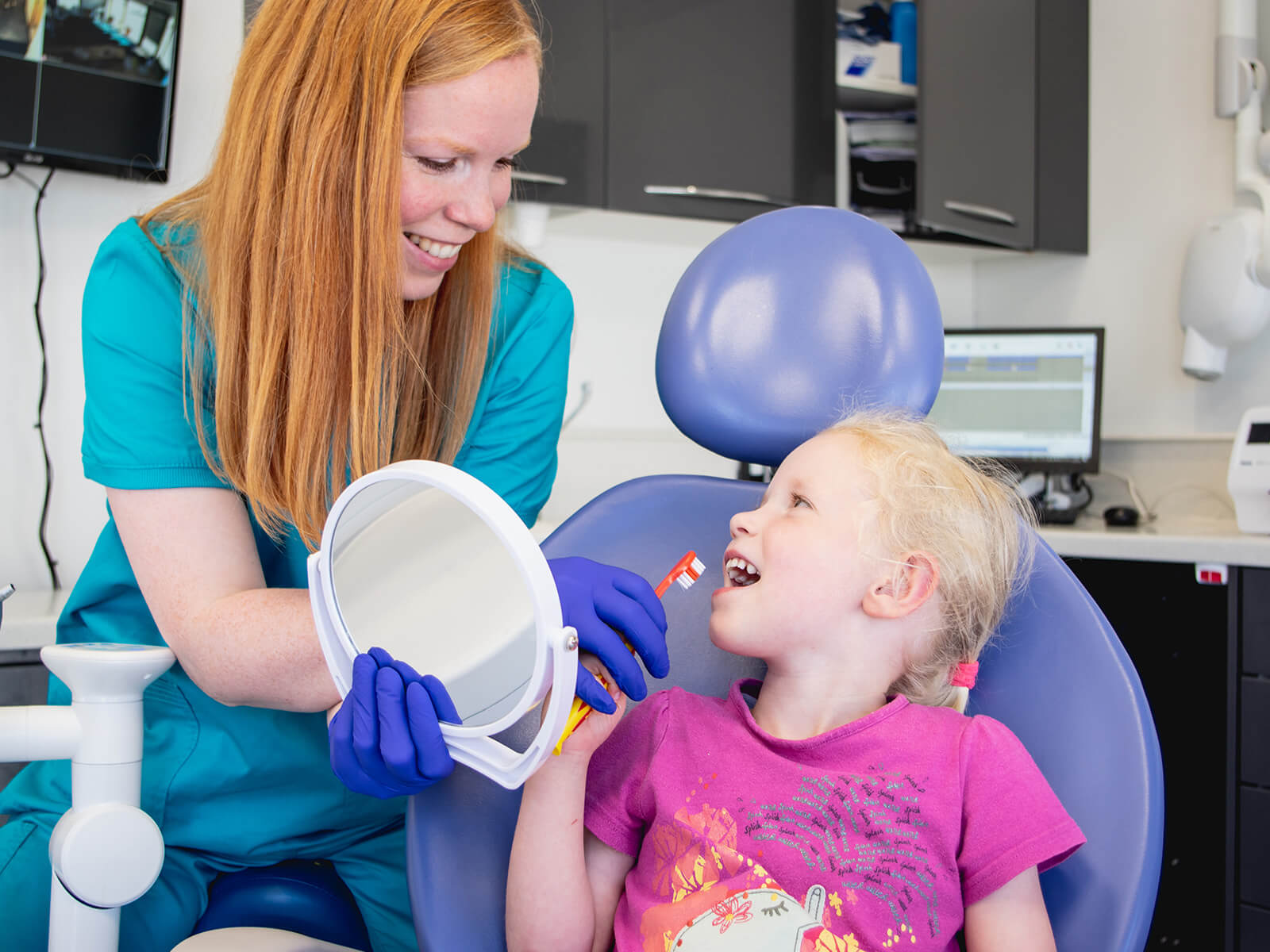 Photo of dentist and patient